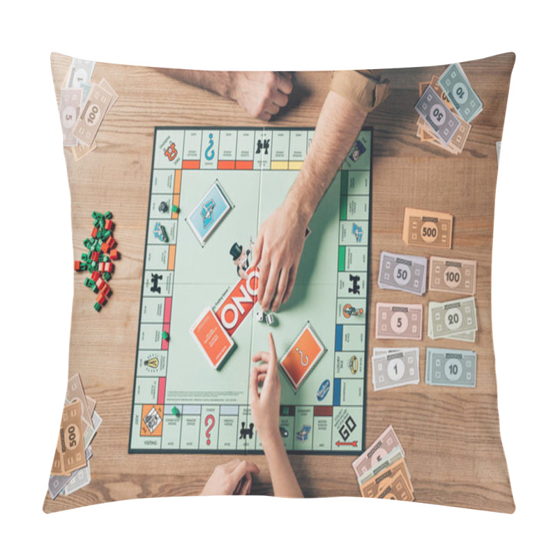 Personality  KYIV, UKRAINE - NOVEMBER 15, 2019: Cropped View Of Man And Woman Playing Monopoly With Toy Currency On Table Pillow Covers