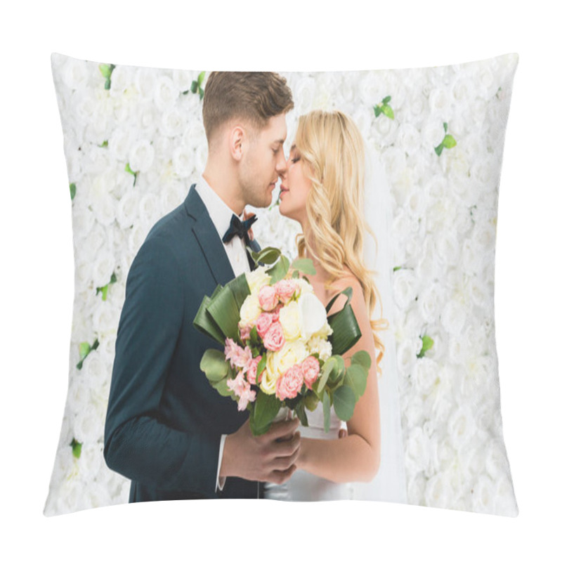 Personality  Happy Young Bride And Groom Kissing While Holding Wedding Bouquet On White Floral Background Pillow Covers