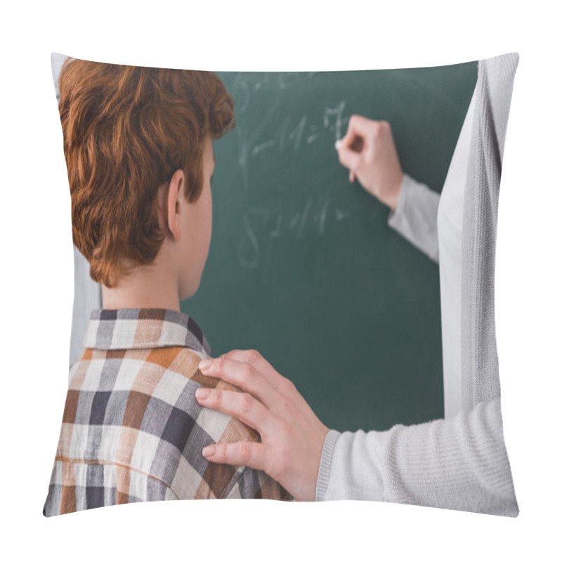 Personality  Teacher Touching Shoulder Of Redhead Schoolboy While Writing On Chalkboard On Blurred Background Pillow Covers