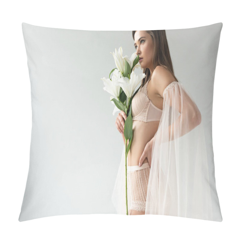 Personality  Side View Of Delicate Young Woman In Beige Lingerie And Mesh Sleeves Smelling Lilies Isolated On White Pillow Covers