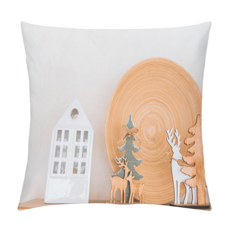 Personality  A Shelf Displays Wooden And Ceramic Ornaments, Including Trees, Reindeer, And A House, Complemented By A Circular Natural Plate. The Arrangement Creates A Cozy Atmosphere. Pillow Covers