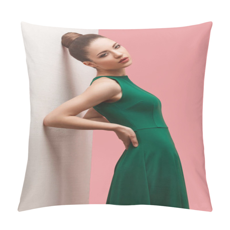 Personality   Beautiful Young Woman With Bun Hairstyle And Makeup In Green Dress Standing With Hands On Waist And Looking At Camera While Leaning On White Wall Against Pink Background Pillow Covers