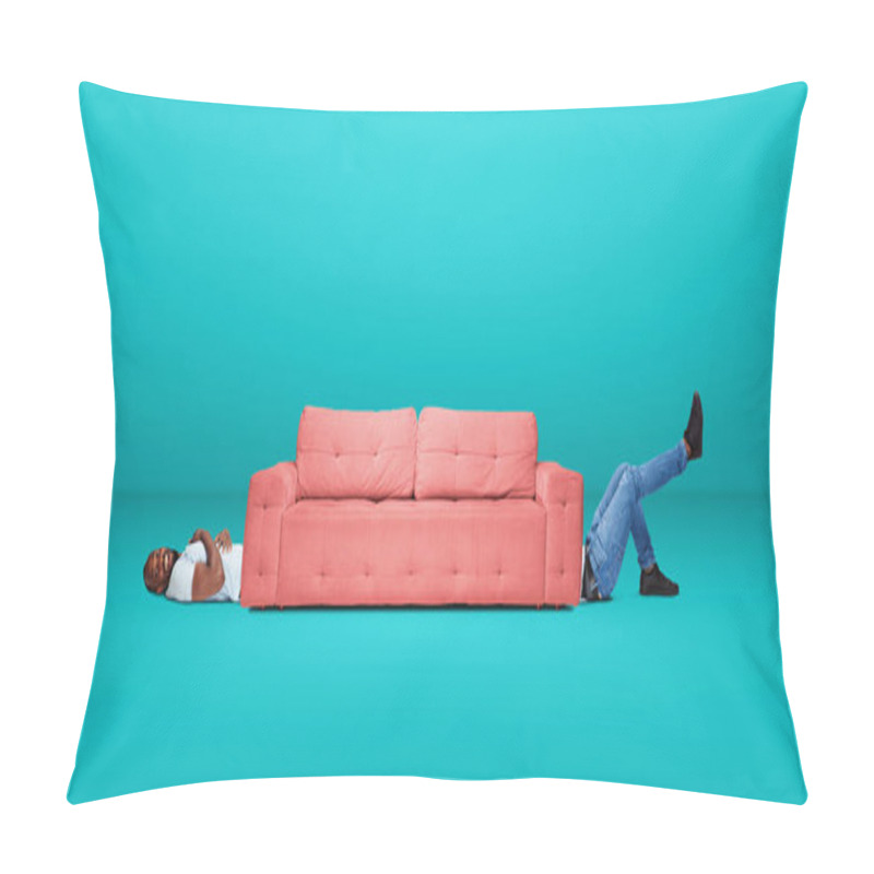 Personality  Tall High Man And Long Sofa Isolated On Blue Studio Background. Unusual Delighted And Long Pillow Covers