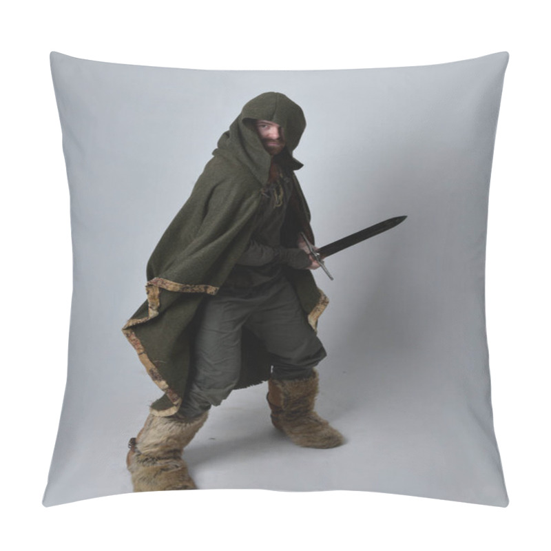 Personality  Full Length  Portrait Of  Young Handsome Man  Wearing  Medieval Celtic Adventurer Costume With Hooded Cloak, Holding Sword, Isolated On Studio Background. Pillow Covers