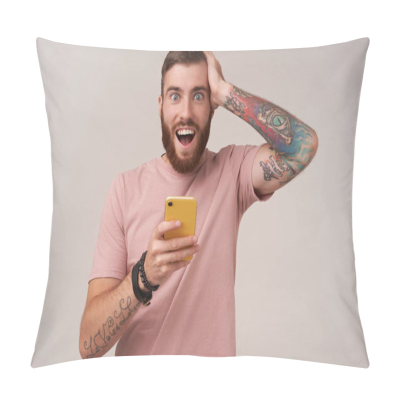 Personality  Overjoyed Attractive Blue-eyed Young Unshaved Man With Tattooes Clutching His Head With Raised Hand And Looking At Camera With Surprised Face, Isolated Over White Background Pillow Covers