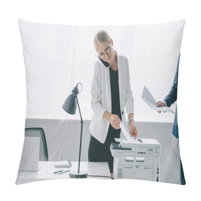 Personality  Businesswoman Talking On Smartphone While Using Printer In Office With Colleague Near By Pillow Covers