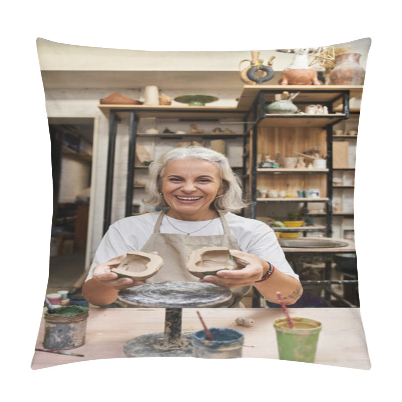 Personality  A Smiling Mature Woman Showcases Her Handcrafted Pottery In A Vibrant Art Studio. Pillow Covers