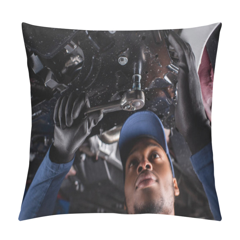 Personality  Low Angle View Of African American Mechanic In Cap Using Wrench While Working In Car Service  Pillow Covers