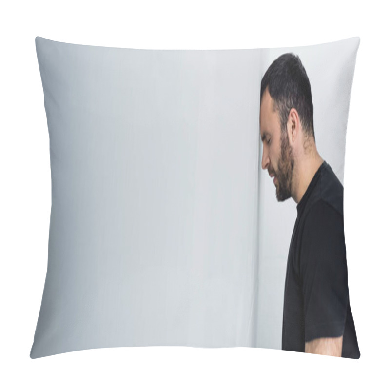 Personality  Panoramic Shot Of Depressed Bearded Man Standing By White Wall With Closed Eyes Pillow Covers