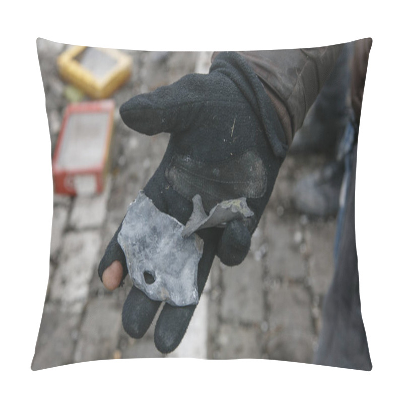 Personality  UKRAINE, KHARKIV, 01 MARCH 2022: A Man Holding A Fragment Of A Military Weapon In His Hands. Pillow Covers