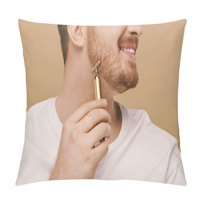 Personality  Handsome Man In Casual Attire Holds A Shiny Gold Face Roller In His Hand. Pillow Covers