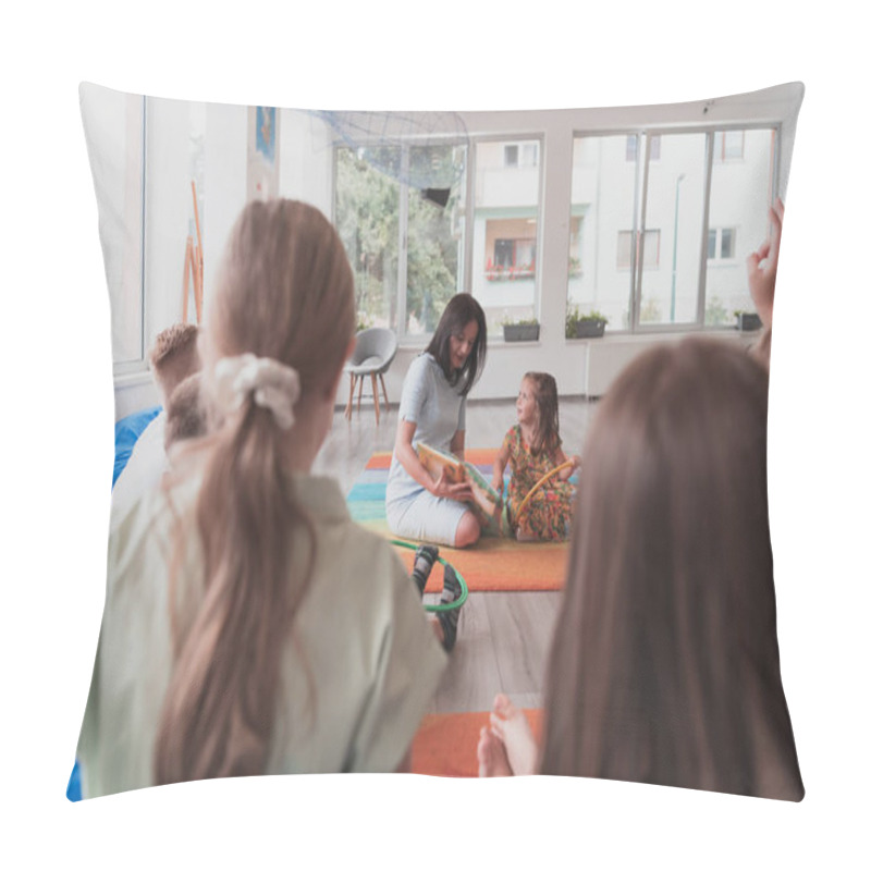 Personality  Reading Time In An Elementary School Or Kindergarten, A Teacher Reads A Book To Children In An Elementary School Or Kindergarten. The Concept Of Pre-school Education. Selective Focus.  Pillow Covers