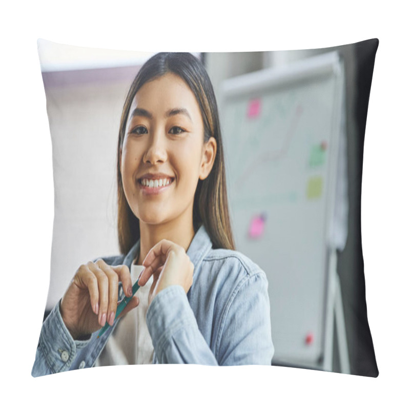 Personality  Portrait Of Young And Charming Asian Businesswoman With Brunette Hair And Cheerful Smile Holding Pen And Looking At Camera In Modern Office, Professional Headshot  Pillow Covers