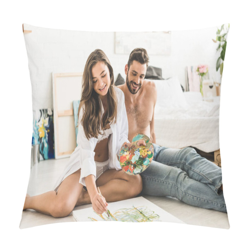 Personality  Happy Couple Sitting On Floor While Girl Paiting And Man Looking At Process  Pillow Covers