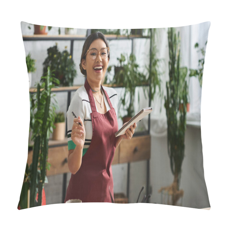 Personality  A Young Woman In An Apron Smiles As She Takes Inventory In Her Plant Store, Surrounded By Lush Greenery. Pillow Covers