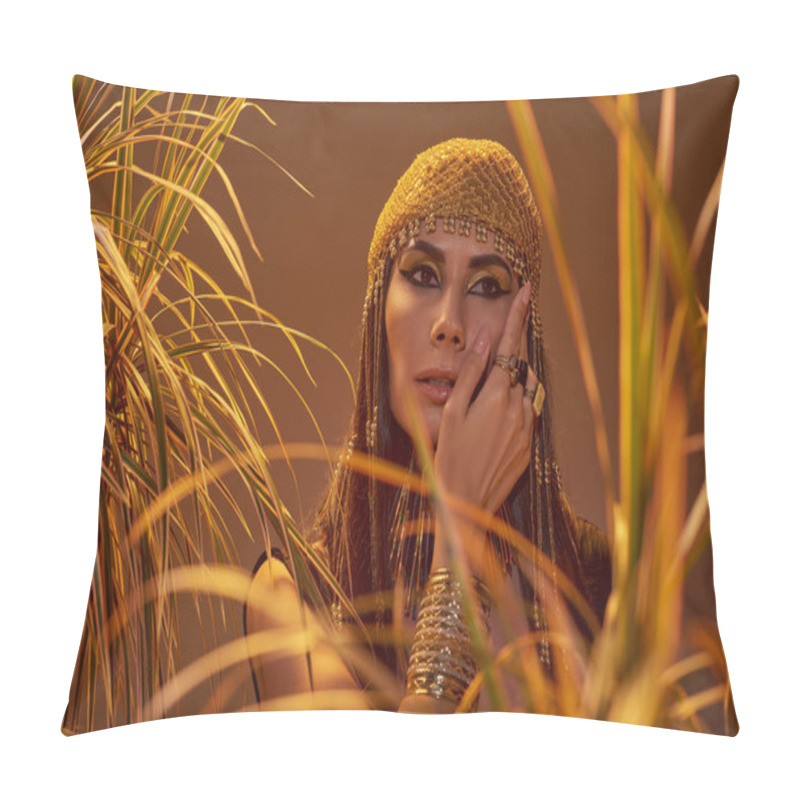 Personality  Woman In Egyptian Headdress And Necklace Touching Cheek Near Plants Isolated On Brown Pillow Covers