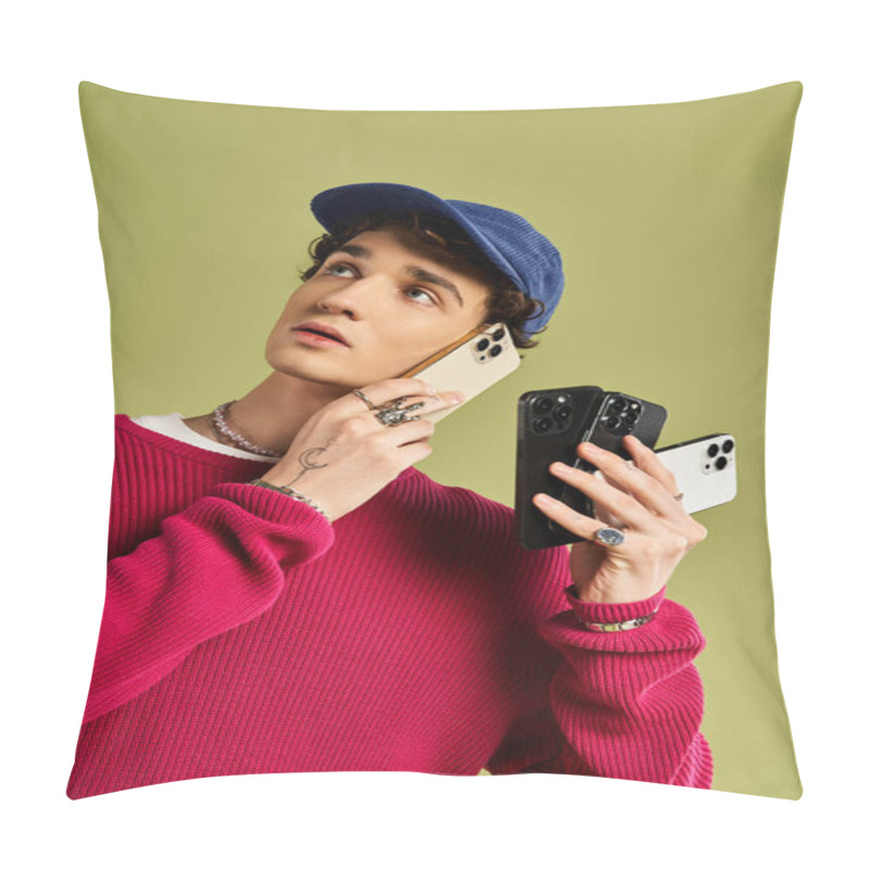 Personality  A Stylish Young Man Poses Thoughtfully With A Pink Sweater And Three Smartphones, Set Against A Soft Green Background. Pillow Covers