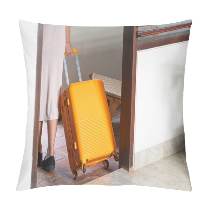 Personality  A Woman Walking By A Poolside With An Orange Suitcase, Wearing A Hat And Stylish Outfit. The Background Features Lush Greenery And A Wooden Structure, Creating A Tropical Vacation Vibe. Pillow Covers