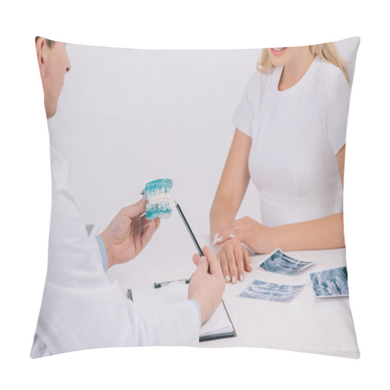 Personality  Cropped View Of Orthodontist Pointing At Jaw Model During Consultation With Woman Isolated On White Pillow Covers