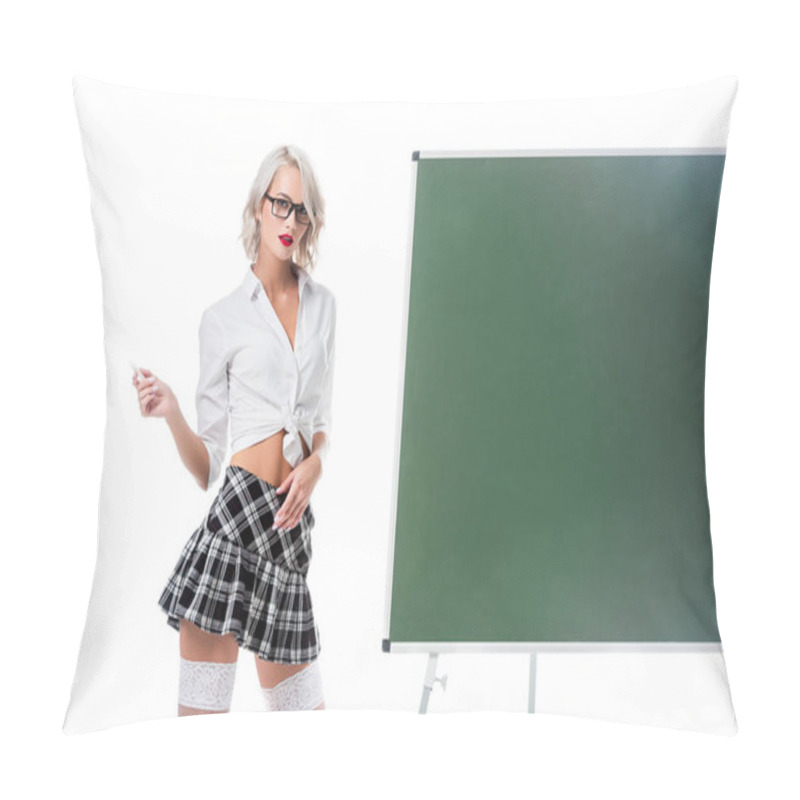 Personality  Portrait Of Blond Woman In Seductive School Uniform With Piece Of Chalk Standing At Empty Chalkboard Isolated On White Pillow Covers