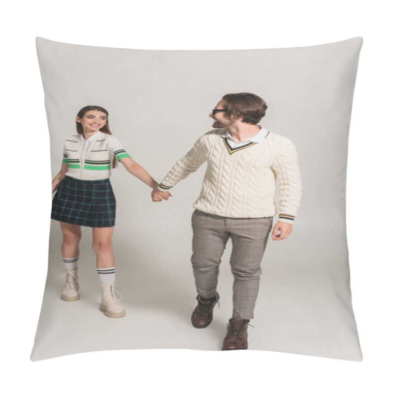 Personality  Happy And Fashionable Couple Holding Hands While Walking On Grey Background Pillow Covers