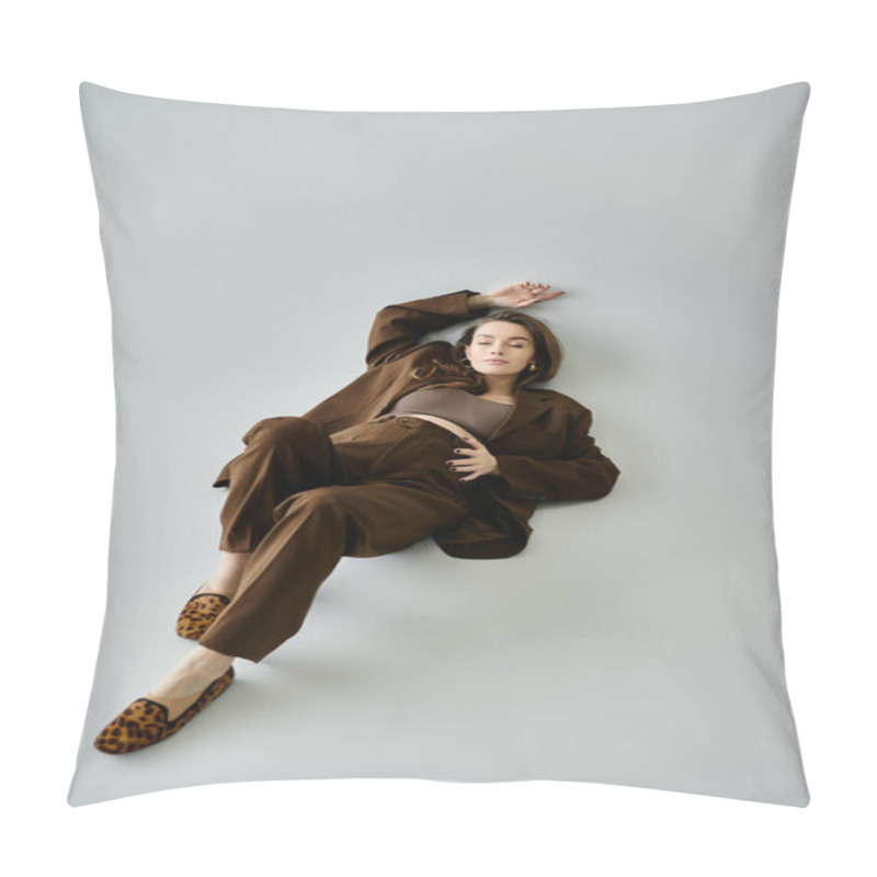 Personality  A Serene Young Pregnant Woman In A Sophisticated Brown Outfit Lounging Gracefully On The Ground. Pillow Covers