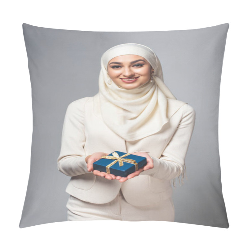 Personality  Happy Young Muslim Woman Holding Gift Box And Smiling At Camera Isolated On Grey Pillow Covers