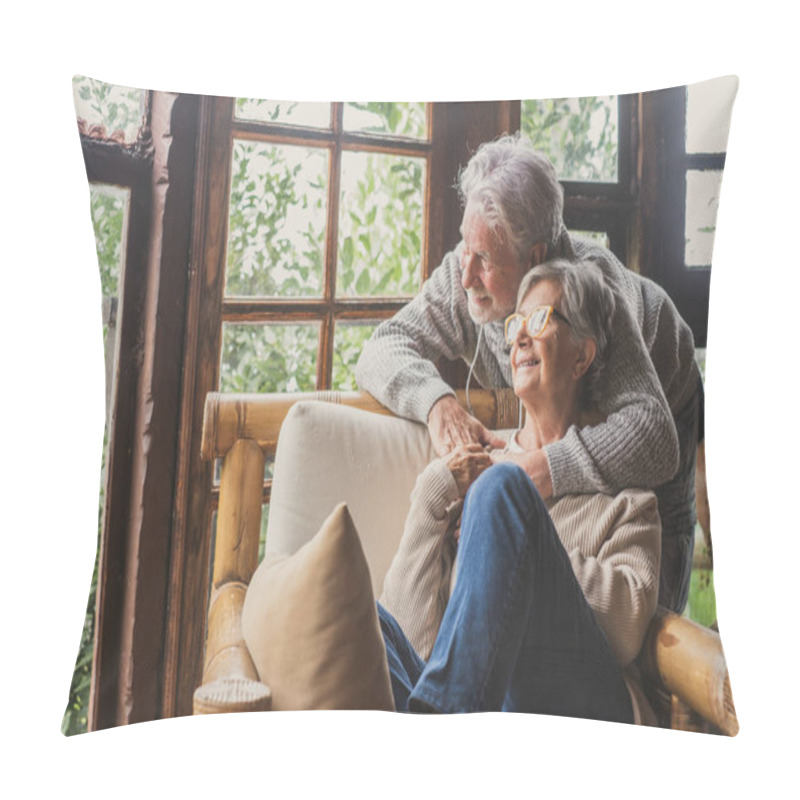 Personality  Old Caucasian Couple Spending Leisure Time Looking Out Through Window At Home. Loving Husband Embracing Wife From Behind Sitting On Armchair At House And Admiring View From Transparent Door Glass.  Pillow Covers