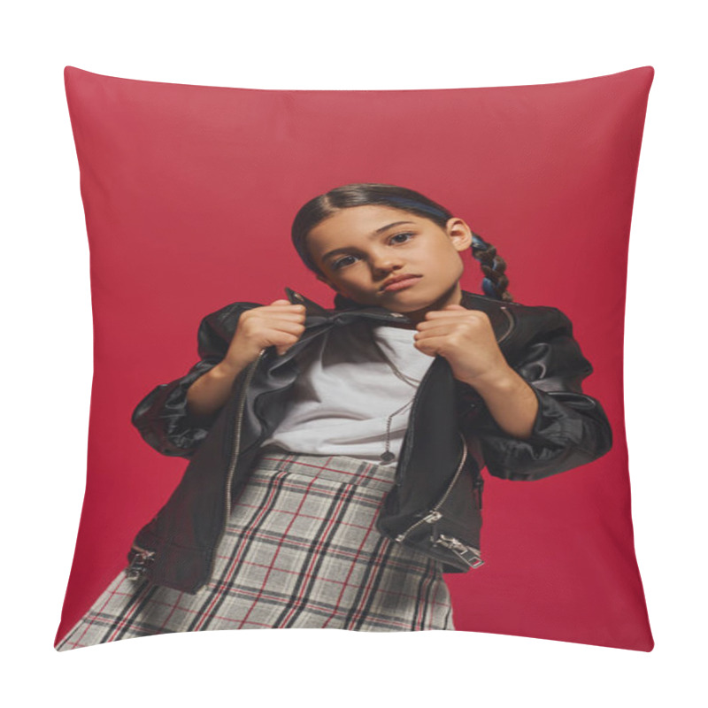 Personality  Portrait Of Fashionable Preadolescent Girl With Hairstyle Posing In Checkered Skirt While Holding Leather Jacket And Looking At Camera Isolated On Red, Stylish Preteen Outfit Concept Pillow Covers