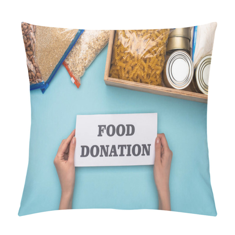 Personality  Cropped View Of Woman Holding Card With Food Donation Lettering Near Cans And Groats In Zipper Bags In Box On Blue Background Pillow Covers