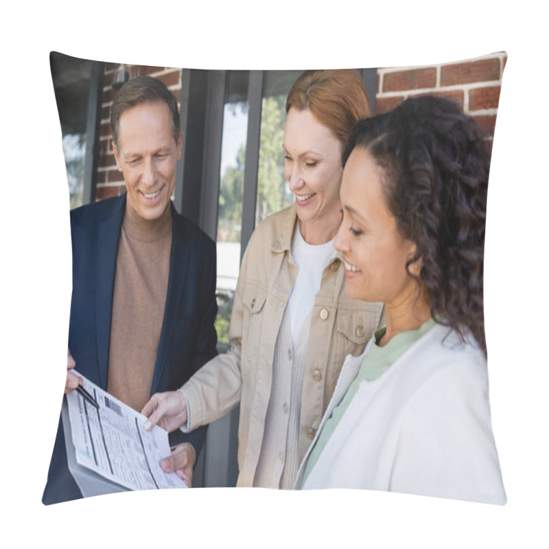 Personality  Middle Aged Realtor Holding Folder With Loan Application Near Happy And Interracial Lesbian Couple  Pillow Covers