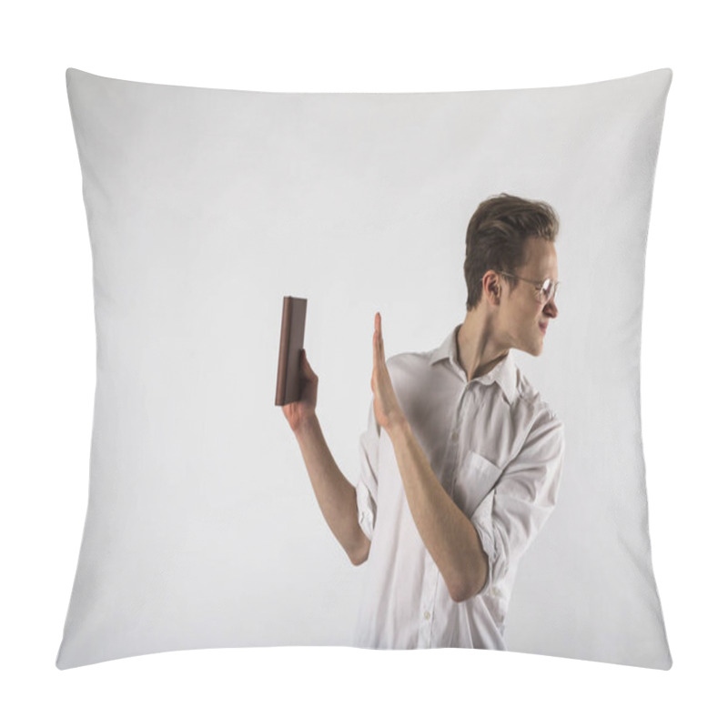 Personality  Young Man Holding Workbook In His Hands. Guy With Glasses. Dislike And Refuse Concept. Pillow Covers