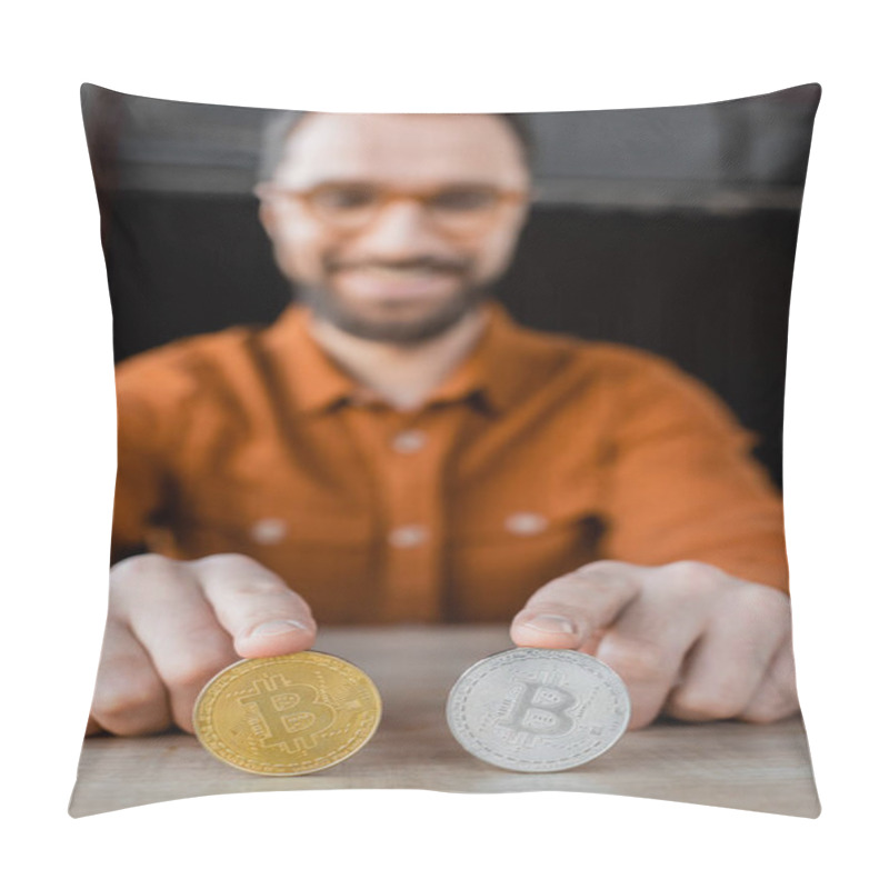 Personality  KYIV, UKRAINE - OCTOBER 18, 2022: Bearded Successful Businessman Touching Silver And Golden Bitcoins While Sitting At Work Desk In Office And Smiling On Blurred Background Pillow Covers