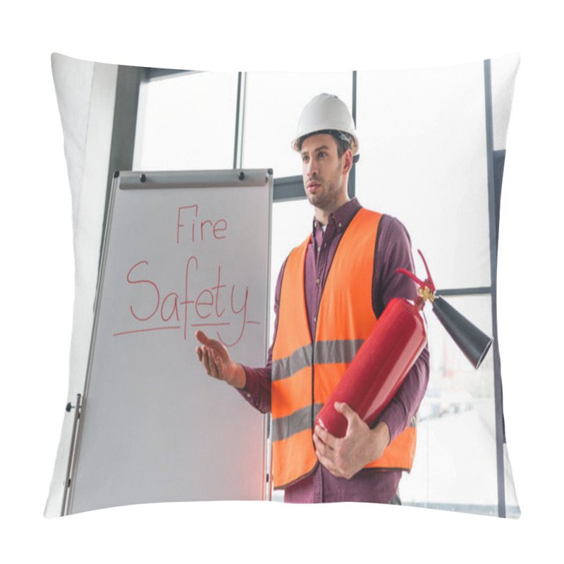 Personality  Handsome Fireman Holding Red Extinguisher While Standing Near White Board With Fire Safety Lettering Pillow Covers