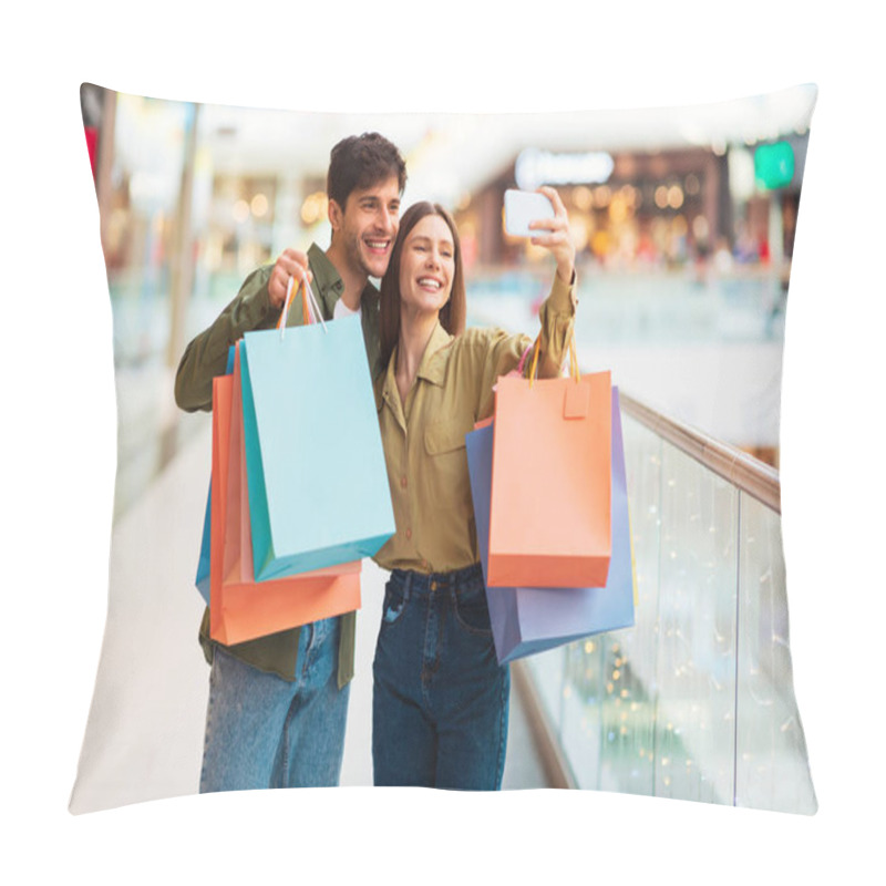 Personality  Sales Offer. Happy Customers Couple Shopping And Making Selfie On Cellphone Having Fun In Modern Mall Indoor. Buyers Taking Photos On Phone Posing With Shopper Bags. Shopaholism Concept Pillow Covers