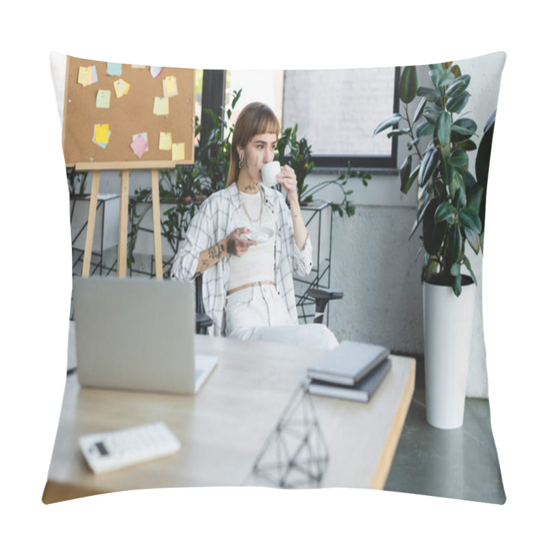 Personality  Stylish Tattooed Woman Drinking Coffee While Sitting At Work Desk Near Blurred Laptop Pillow Covers