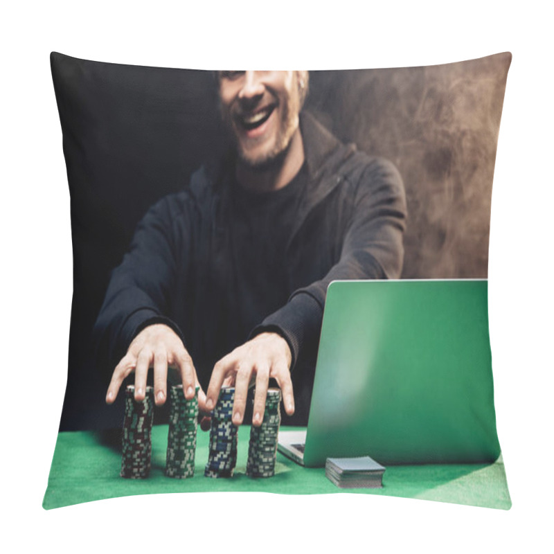 Personality  KYIV, UKRAINE - AUGUST 20, 2019: Happy Man Touching Poker Chips Near Laptop On Black With Smoke  Pillow Covers