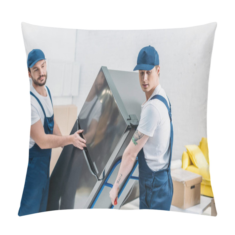 Personality  Two Movers In Uniform Using Hand Truck While Transporting Refrigerator In Apartment Pillow Covers