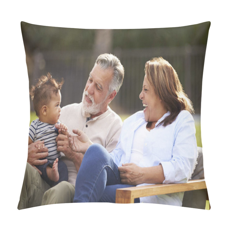 Personality  Senior Couple Sitting In The Garden With Their Baby Grandson, Smiling At Him, Front View Pillow Covers