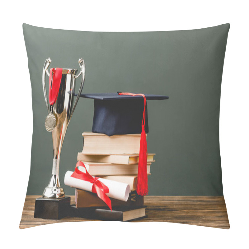 Personality  Books, Diploma, Academic Cap, Trophy Cup And Medal On Wooden Surface Isolated On Grey  Pillow Covers