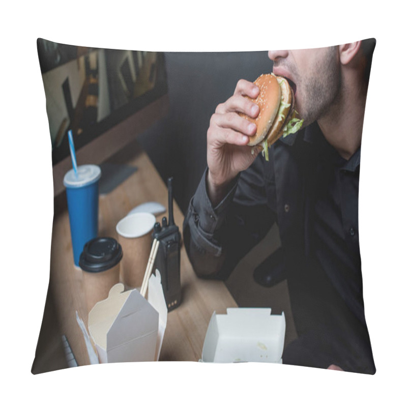 Personality  Cropped View Of Guard Eating Burger At Workplace  Pillow Covers