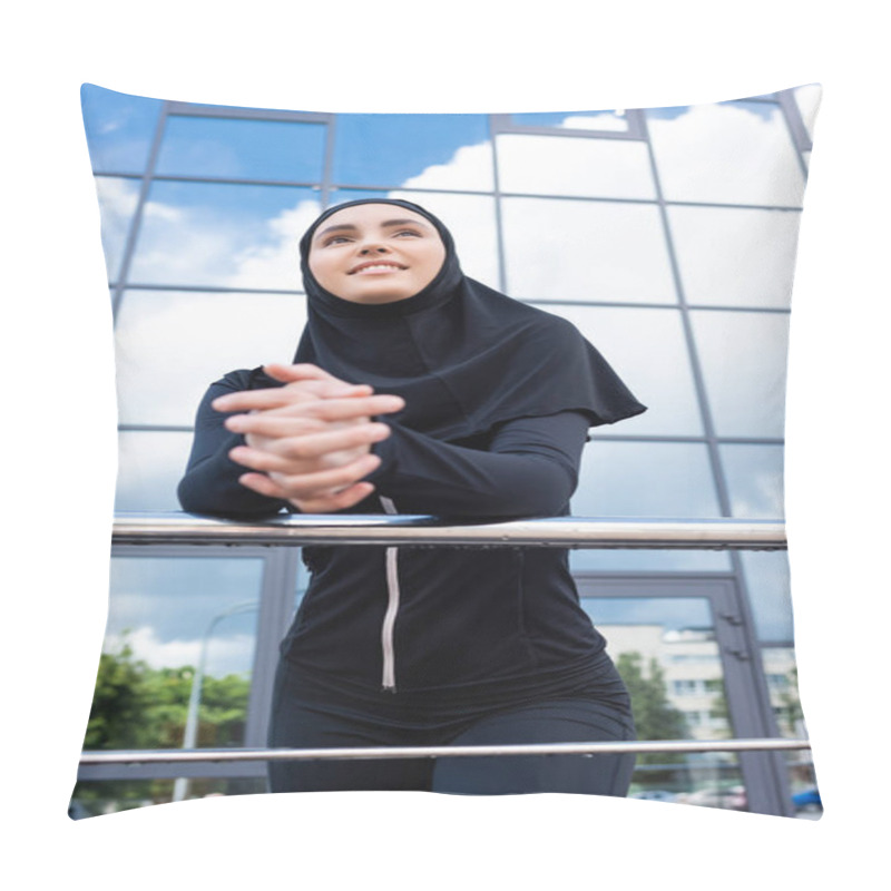 Personality  Selective Focus Of Happy Muslim Woman In Hijab Standing With Clenched Hands Near Modern Building  Pillow Covers