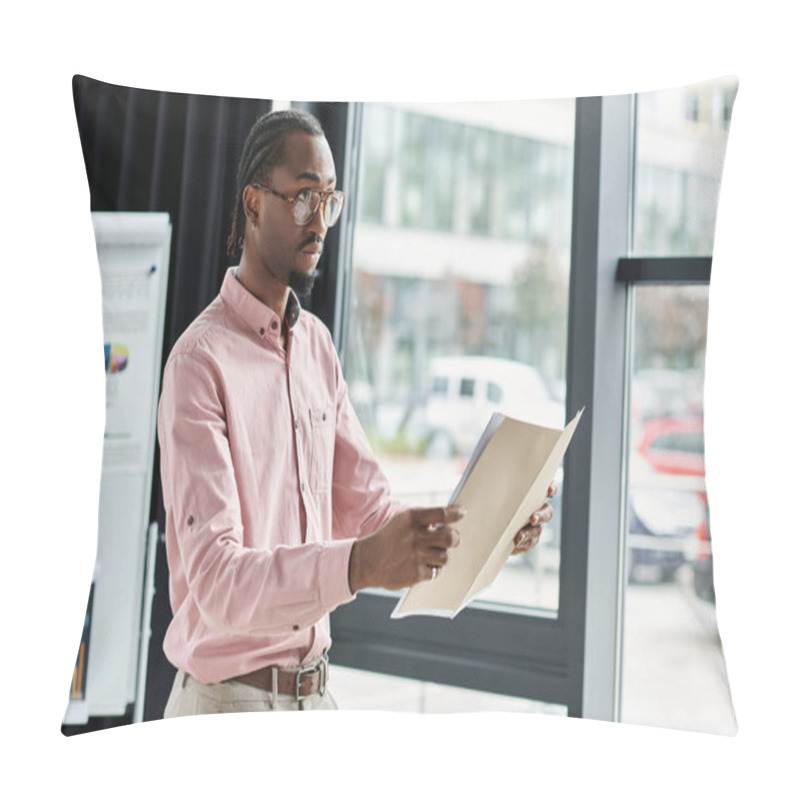 Personality  Focused Young Man Reviewing Documents In A Bright, Modern Workspace While Remote Working. Pillow Covers