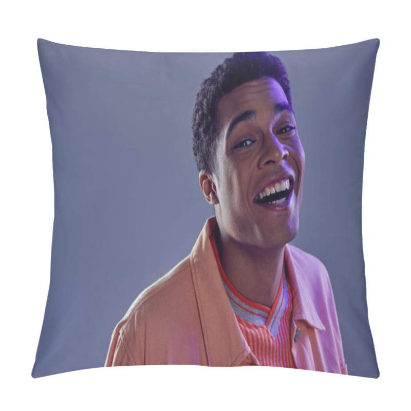 Personality  Portrait Of Joyous African American Guy In Peach Shirt Laughing On Grey Background With Blue Light Pillow Covers