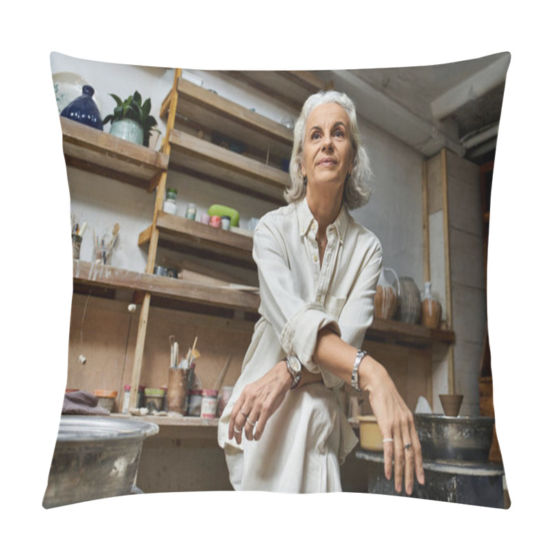 Personality  A Beautiful Mature Woman Sits Pensively In Her Pottery Studio Filled With Artistic Tools. Pillow Covers