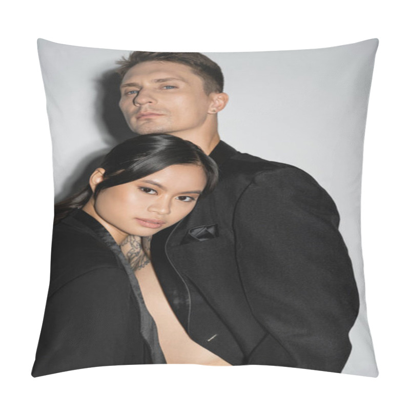 Personality  Trendy Multiethnic Couple In Black Elegant Blazers Looking At Camera On Grey Background Pillow Covers