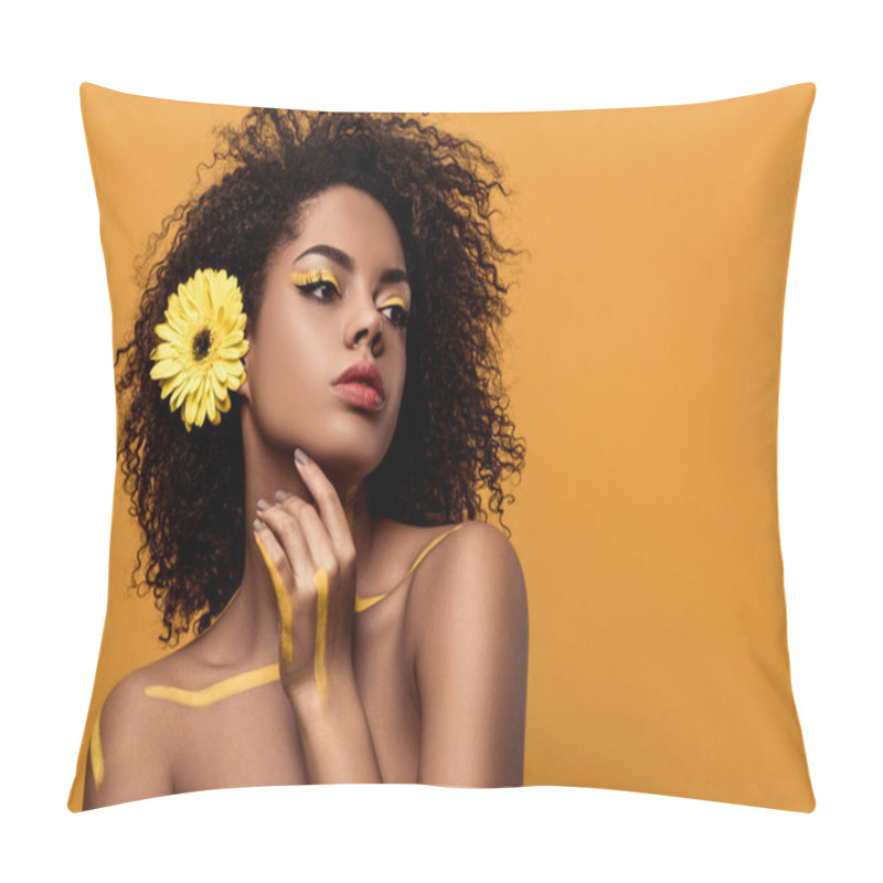 Personality  Young Sensual African American Woman With Artistic Make-up And Gerbera In Hair Holds Hand By Her Face Isolated On Orange Background Pillow Covers