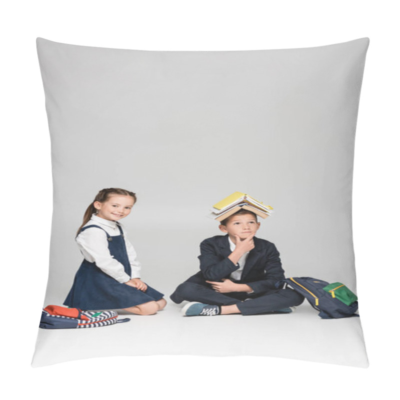 Personality  Pensive Schoolboy With Books On Head Sitting Near Cheerful Girl On Grey Pillow Covers