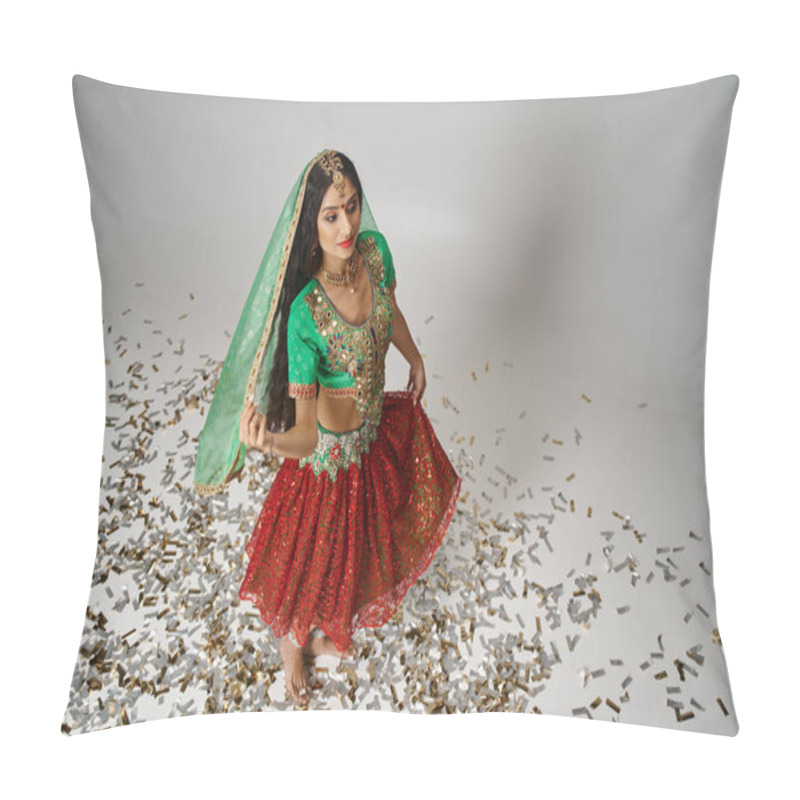 Personality  young pretty indian woman in traditional clothes posing on confetti on floor and looking away pillow covers