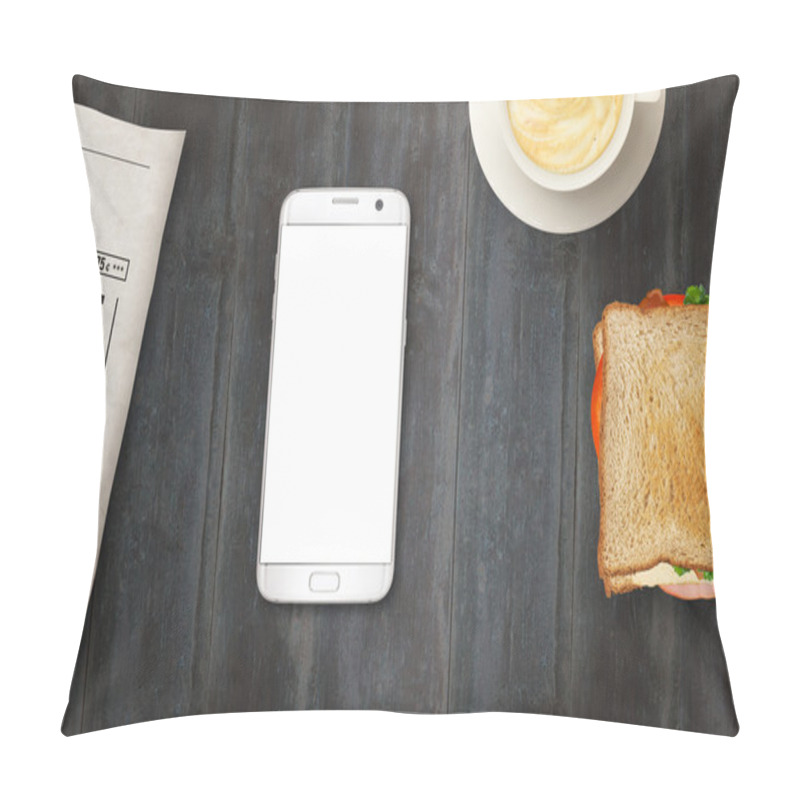 Personality  Smart Phone With Isolated Display For Mockup On Table. Newspapers, Coffee And Sandwich On Table. Top View. Pillow Covers